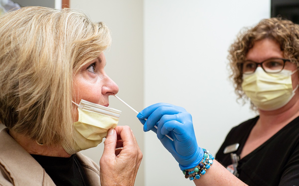 Employee getting tested with a nasal swab