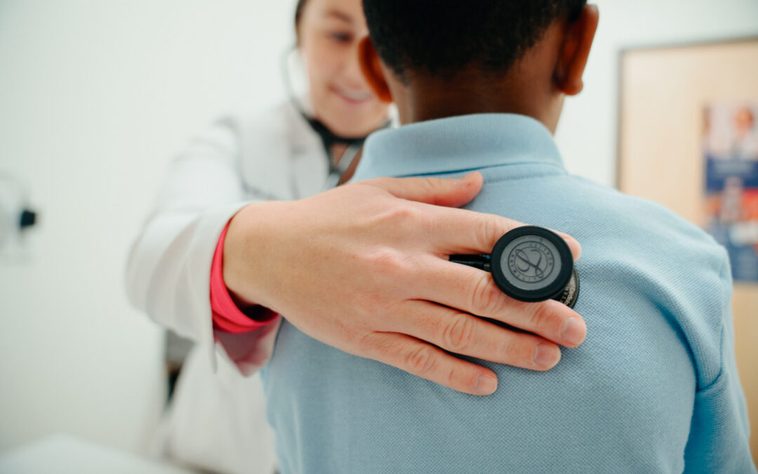 AFC provider checking the lungs of a patient